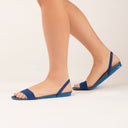Side view of model wearing Gheta Active sandal with insole function in dark and light blue – light, custom-fit, antibacterial and breathable.